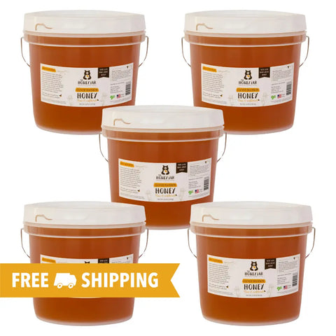 5 gallons of raw clover honey in 5 one-gallon pails for easier use.